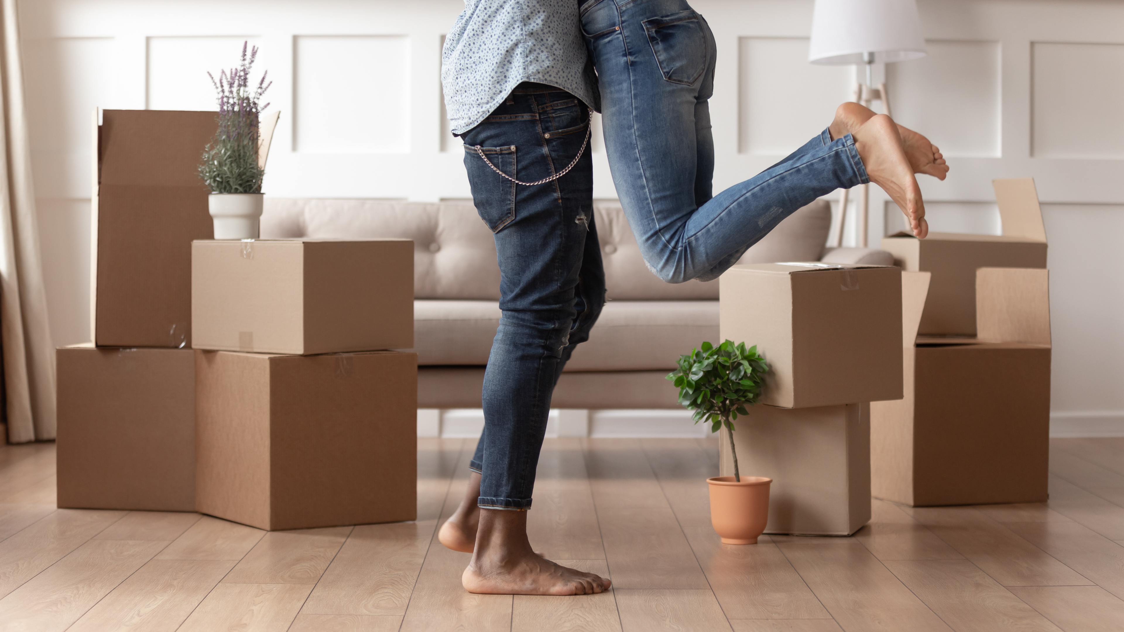 Happy young couple moving in to new home